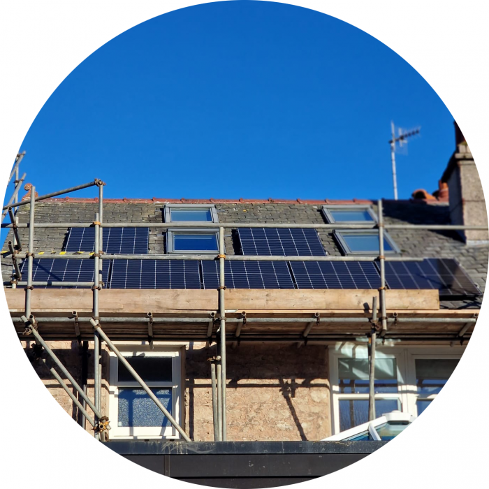 Solar panels on a house with scaffoldings around